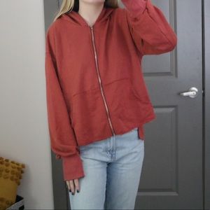 Rust zip up hoodie with grommet detail